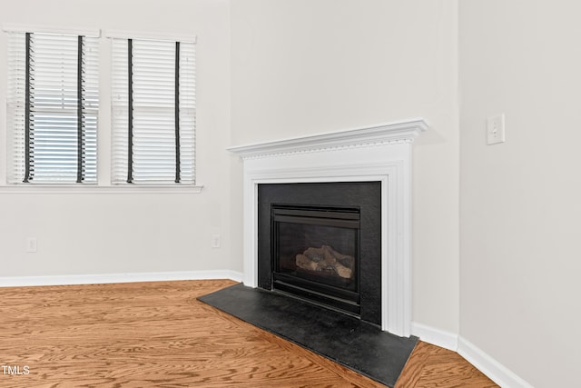 interior details featuring hardwood / wood-style flooring