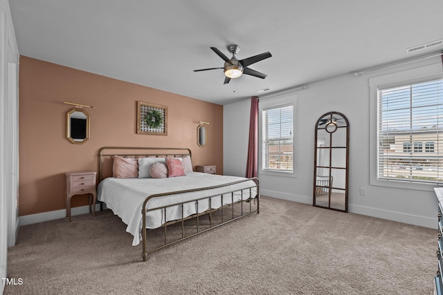 carpeted bedroom with ceiling fan