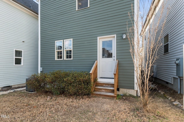 entrance to property featuring central AC unit