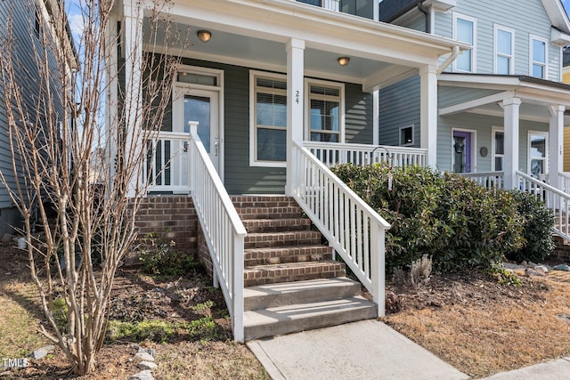 doorway to property featuring a porch