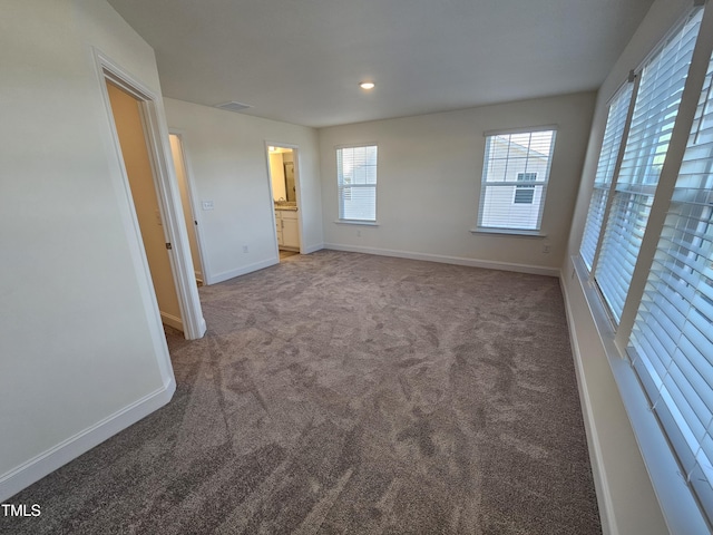 unfurnished room featuring carpet flooring