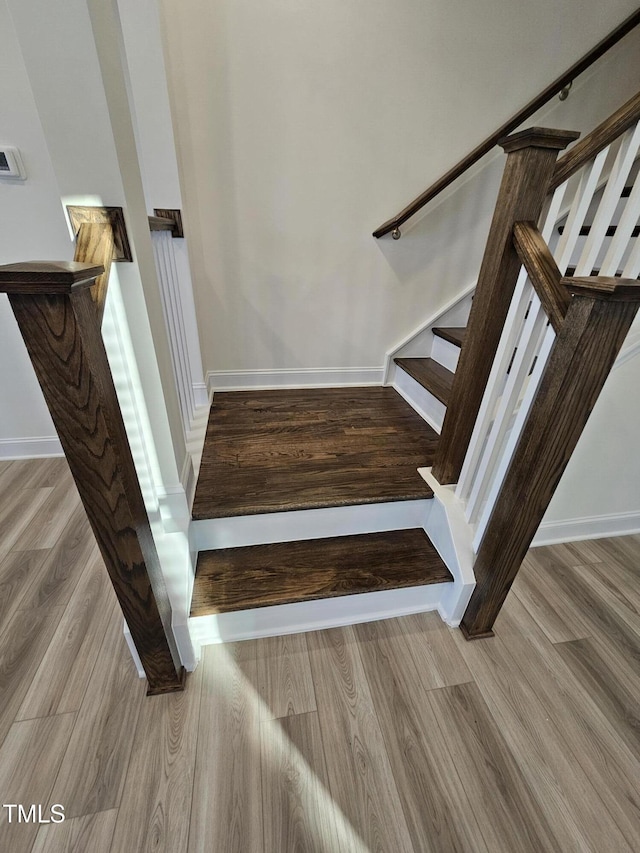 staircase featuring hardwood / wood-style floors