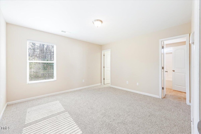 5879 Odenton Ln, Pfafftown, NC 27040 - unfurnished bedroom featuring light colored carpet and baseboards