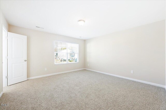 5879 Odenton Ln, Pfafftown, NC 27040 - carpeted spare room featuring baseboards