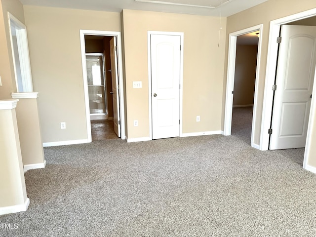 5879 Odenton Ln, Pfafftown, NC 27040 - unfurnished bedroom featuring attic access, carpet floors, and baseboards