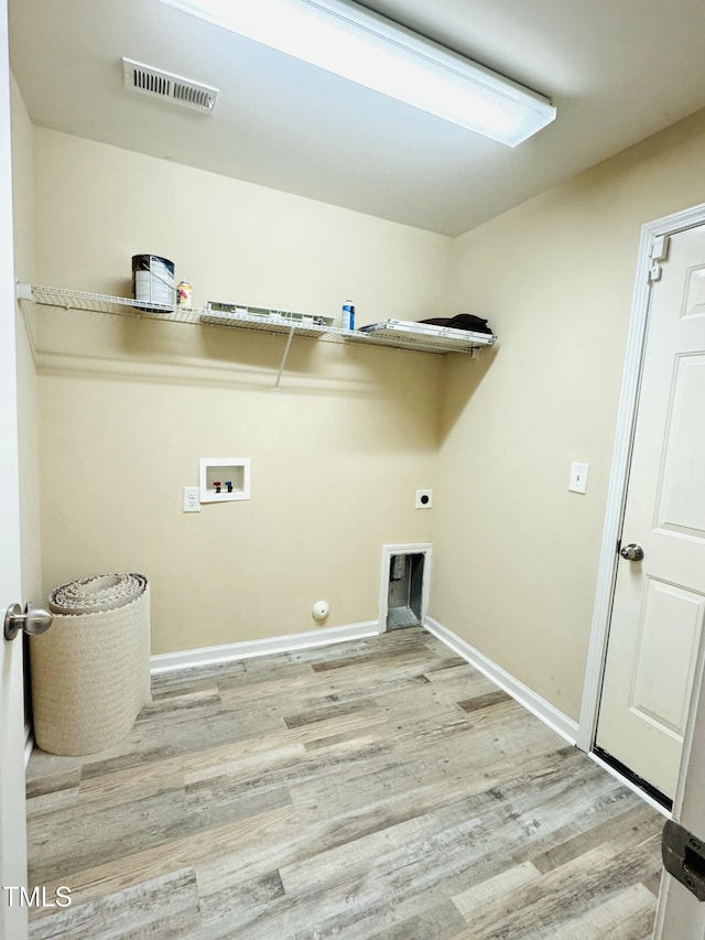 5879 Odenton Ln, Pfafftown, NC 27040 - washroom with hookup for a washing machine, wood finished floors, baseboards, and hookup for an electric dryer
