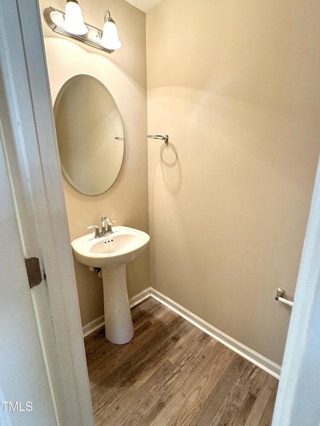 5879 Odenton Ln, Pfafftown, NC 27040 - bathroom with wood finished floors, baseboards, and a sink