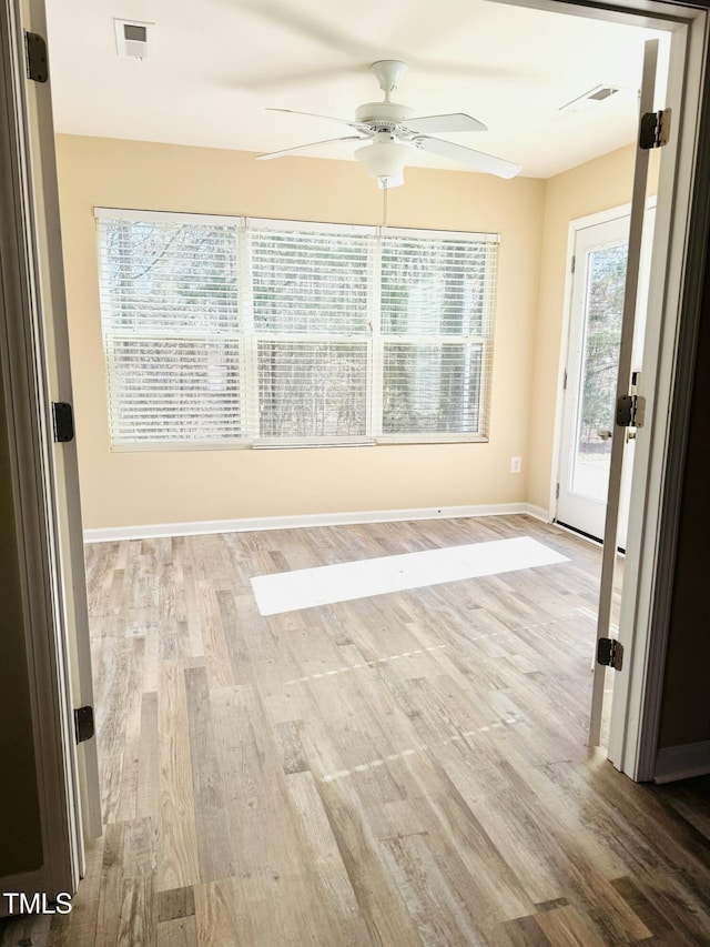 5879 Odenton Ln, Pfafftown, NC 27040 - empty room with ceiling fan, wood finished floors, and baseboards