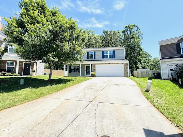 5879 Odenton Ln, Pfafftown, NC 27040 - traditional-style home with concrete driveway and an attached garage