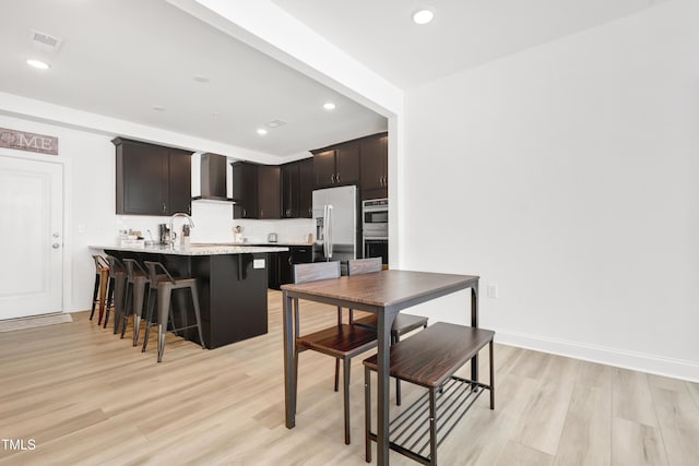 dining room with light wood-type flooring