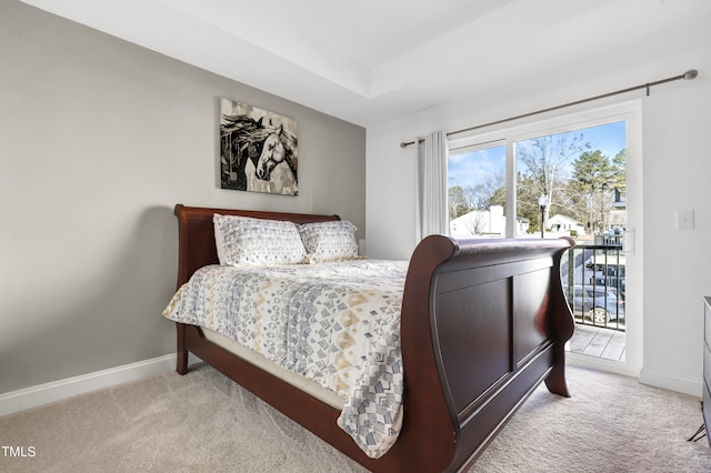 bedroom with light carpet and access to outside