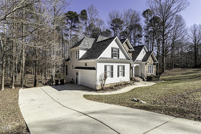 view of front of house with a garage and concrete driveway