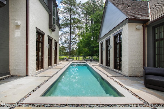 view of pool featuring a patio area