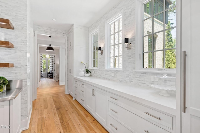 bathroom featuring tasteful backsplash, vanity, and hardwood / wood-style floors