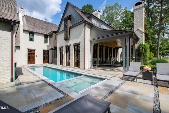 view of swimming pool featuring a patio area