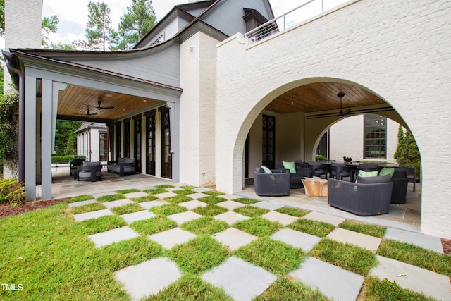 view of patio / terrace featuring ceiling fan and outdoor lounge area