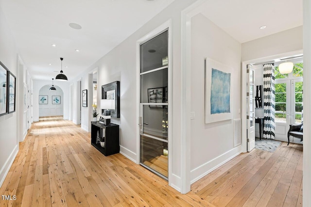 corridor featuring light hardwood / wood-style flooring