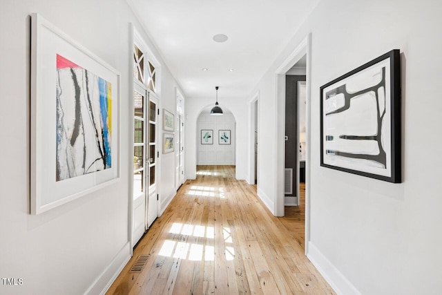 hallway with light wood-type flooring