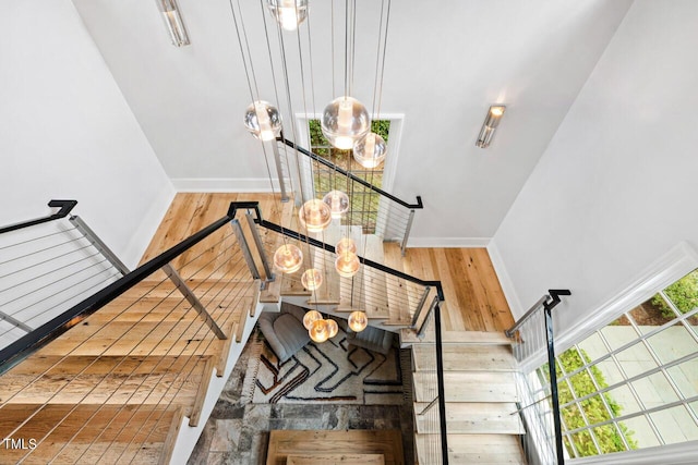 stairs with wood-type flooring