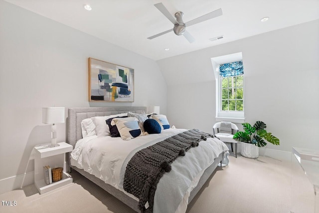 bedroom featuring carpet, lofted ceiling, and ceiling fan