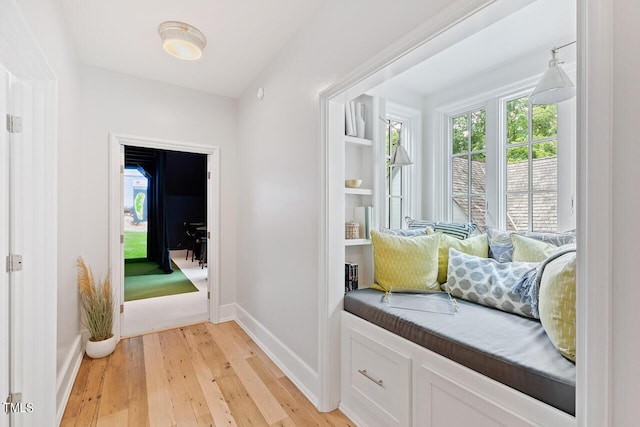 mudroom with light hardwood / wood-style floors