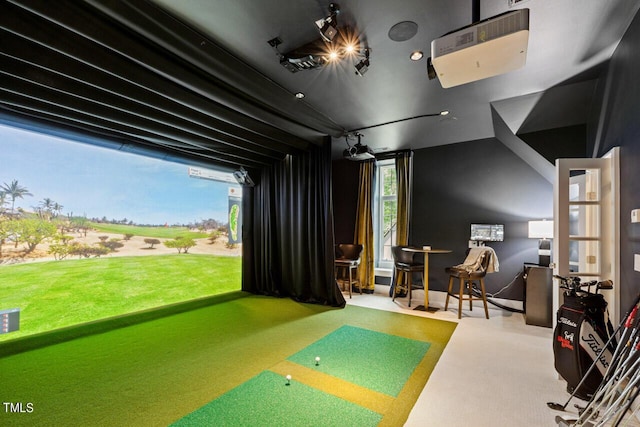 playroom featuring vaulted ceiling, golf simulator, and carpet