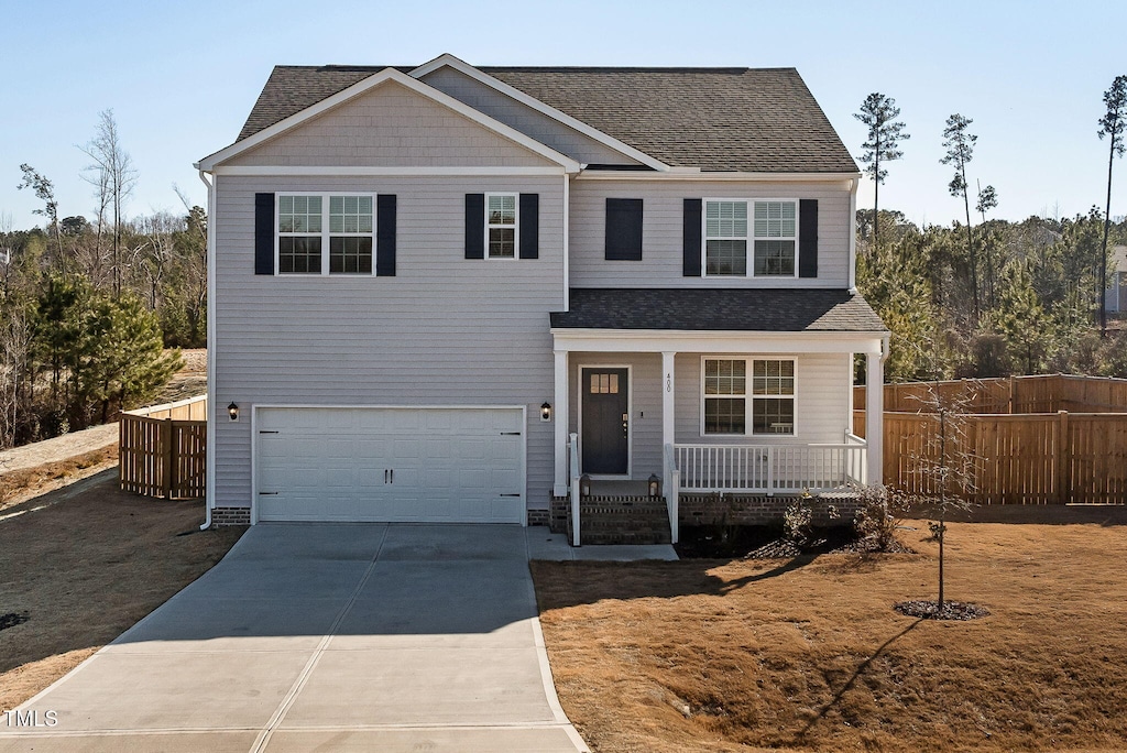 view of front of property featuring a garage and covered porch