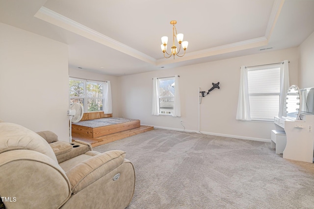 interior space featuring light carpet, a notable chandelier, a tray ceiling, and multiple windows