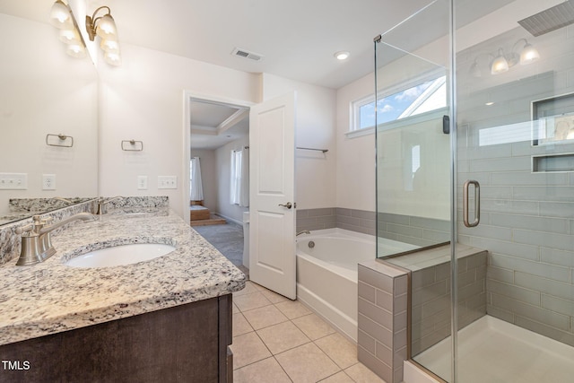 bathroom featuring vanity, separate shower and tub, and tile patterned floors