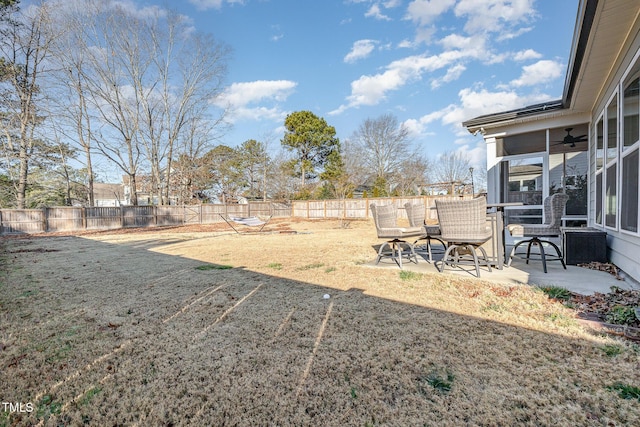 view of yard with ceiling fan and a patio area