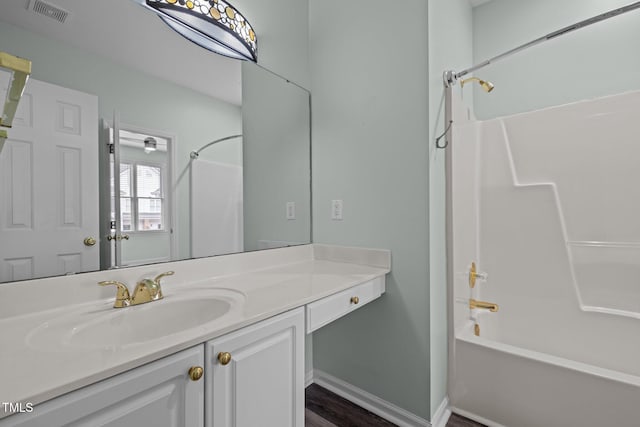 bathroom with vanity and shower / bathtub combination