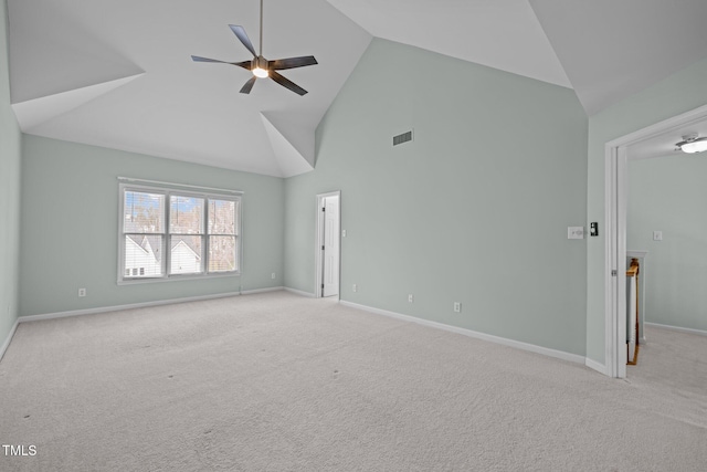 unfurnished room featuring light carpet, high vaulted ceiling, and ceiling fan