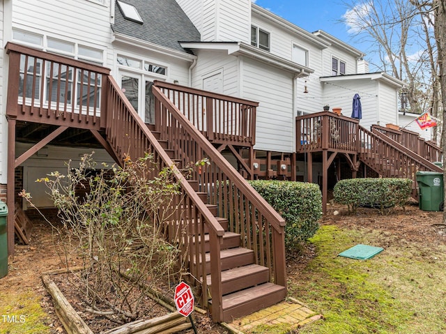 rear view of property with a wooden deck