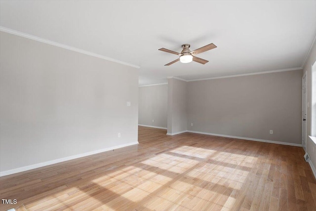 spare room with ornamental molding, ceiling fan, and light wood-type flooring