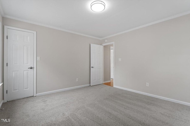 carpeted empty room with ornamental molding