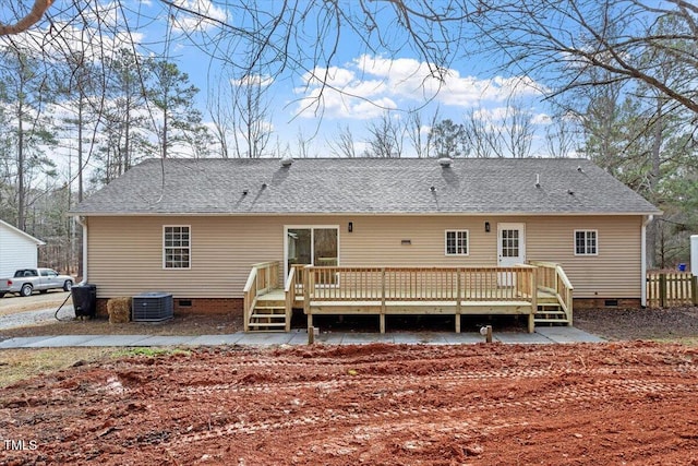 back of property featuring a wooden deck and central AC