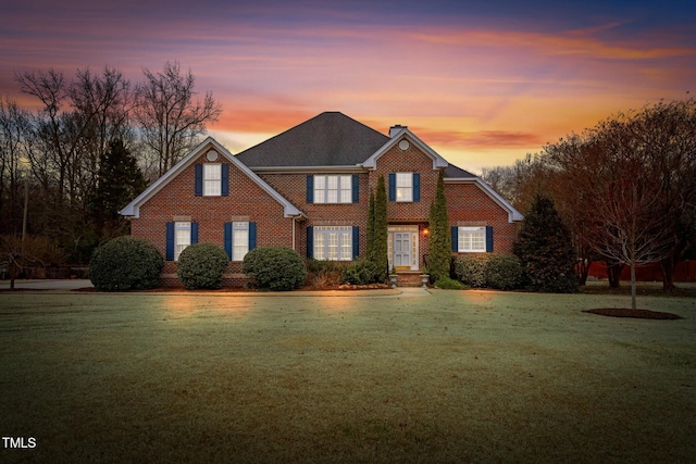 view of front of house featuring a lawn