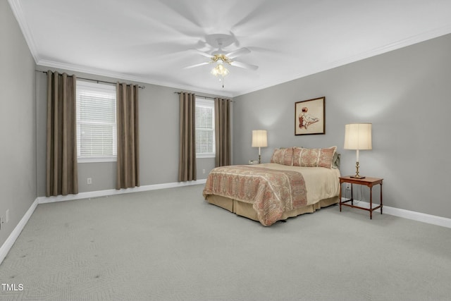 carpeted bedroom featuring ornamental molding and ceiling fan