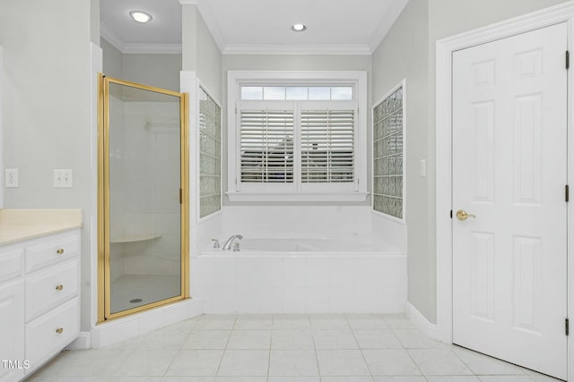 bathroom with tile patterned floors, ornamental molding, plus walk in shower, and vanity