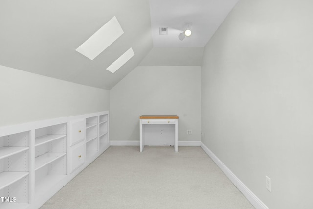 bonus room featuring light colored carpet and vaulted ceiling with skylight