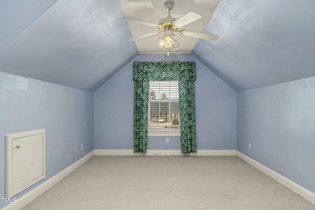 bonus room with ceiling fan, light colored carpet, and vaulted ceiling