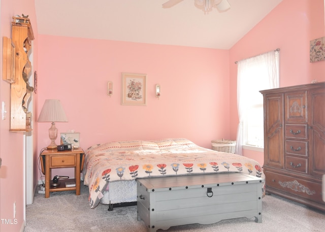 bedroom with light carpet, lofted ceiling, and ceiling fan