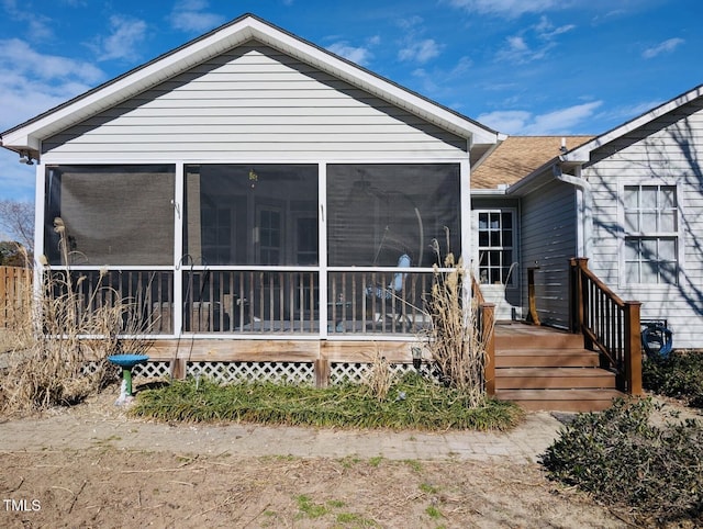 back of property featuring a sunroom