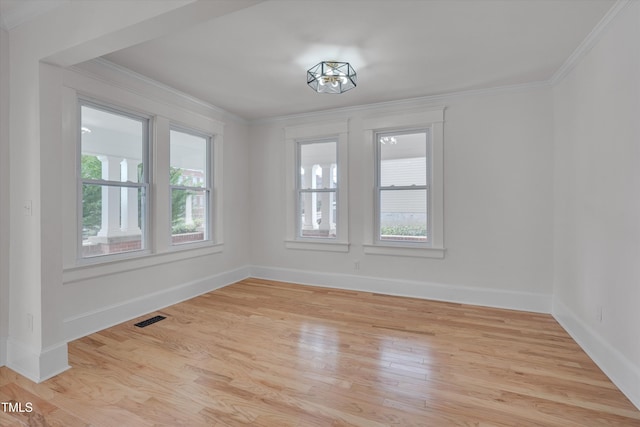 unfurnished dining area featuring ornamental molding and light hardwood / wood-style floors