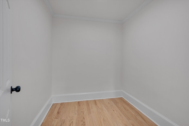 unfurnished room with crown molding and hardwood / wood-style floors