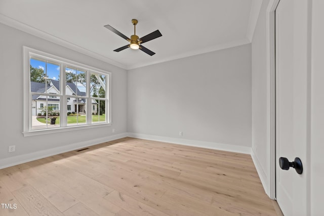 spare room with crown molding, ceiling fan, and light hardwood / wood-style flooring