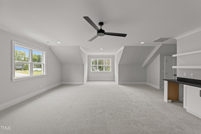 bonus room with lofted ceiling, light colored carpet, and ceiling fan