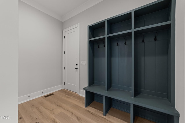 mudroom featuring crown molding and light hardwood / wood-style floors