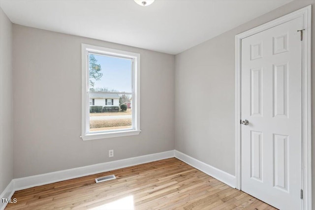 unfurnished room featuring light hardwood / wood-style flooring