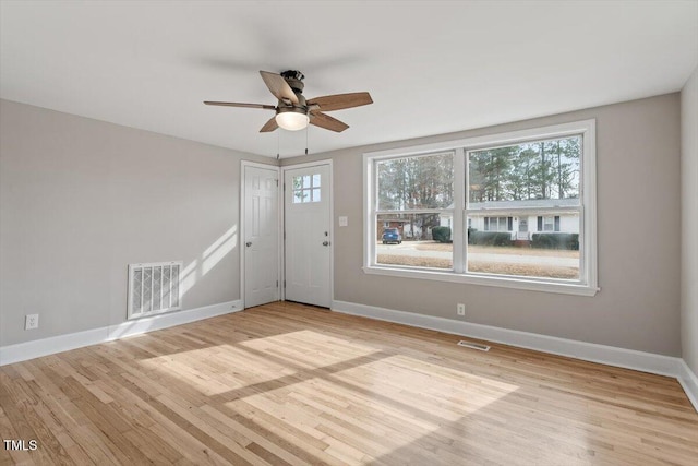 unfurnished room featuring ceiling fan and light hardwood / wood-style flooring